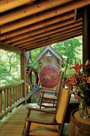 Porches expand the home's living space amd offer forest views.